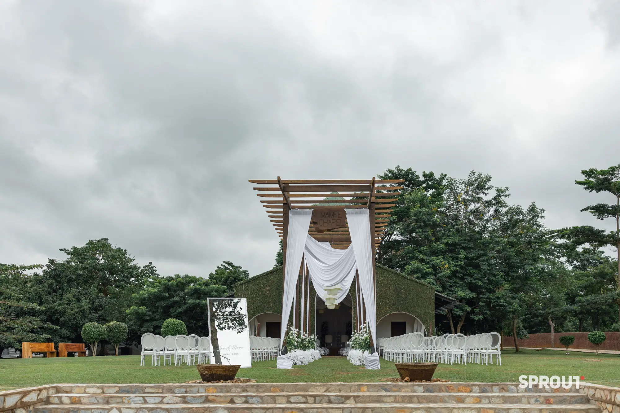 White drapes over a hillside ceremony at Safari Valley
